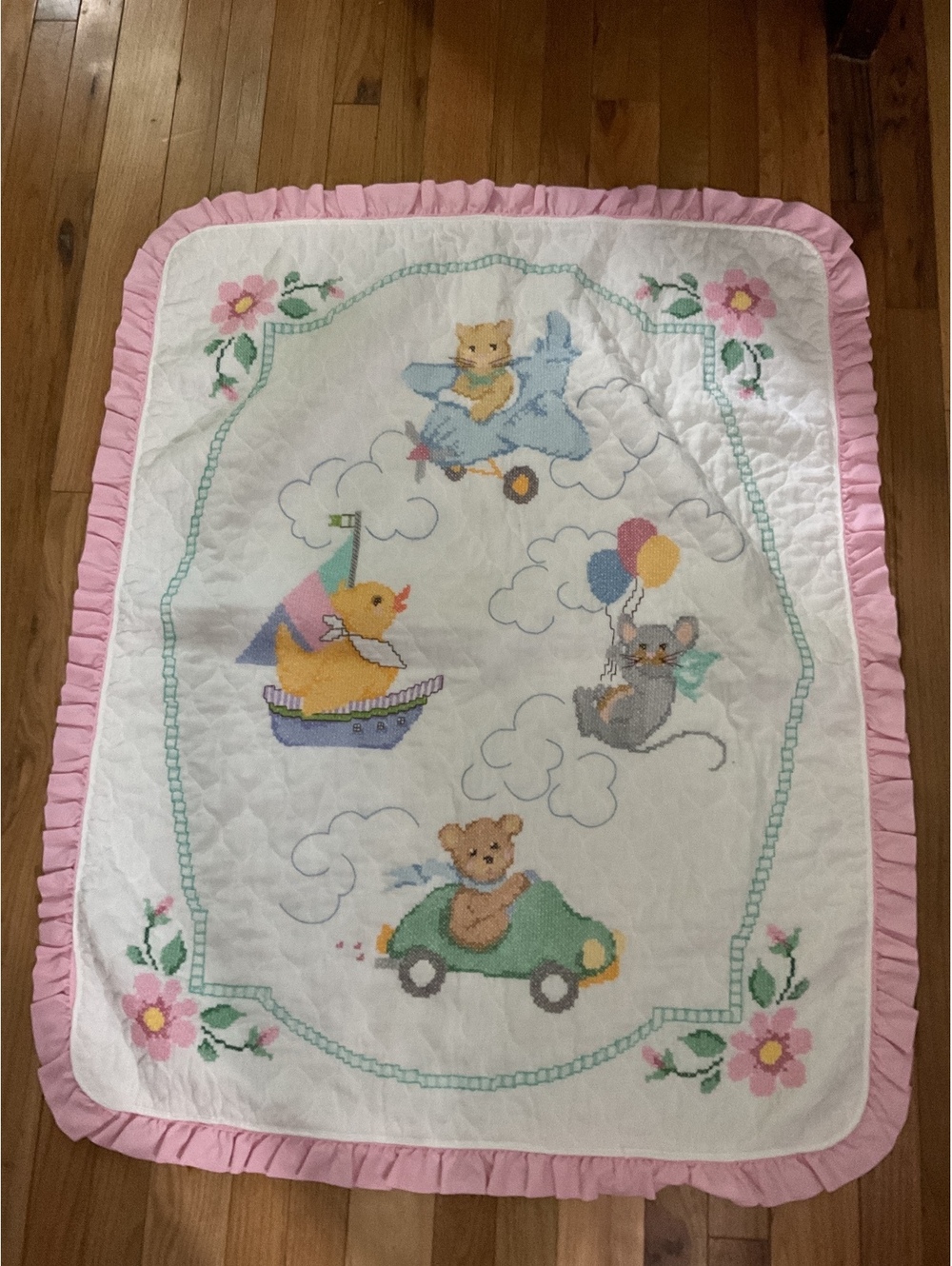 Handmade Baby Quilt with Adorable Animal Cross-Stitch Design and Pink Ruffled Ed